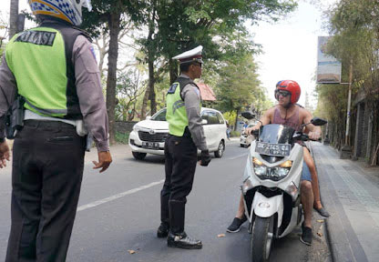 The work of the police in traffic control in Bali